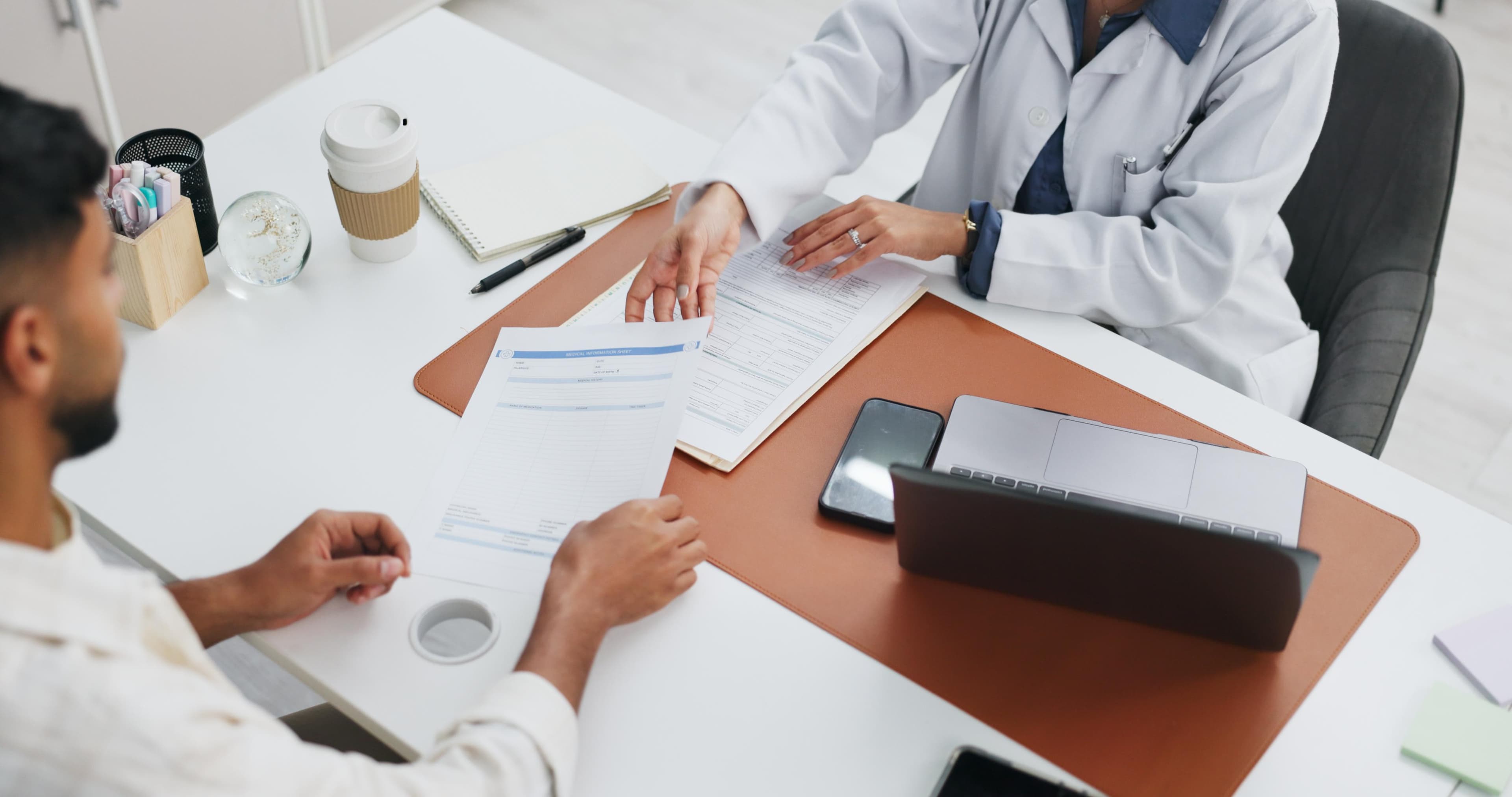 A patient discussing care and planning documents with a coordinator