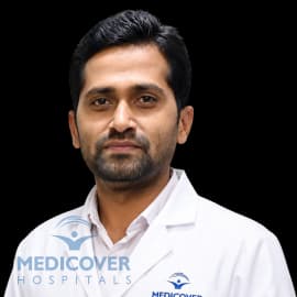 Dr Satish Dhamne